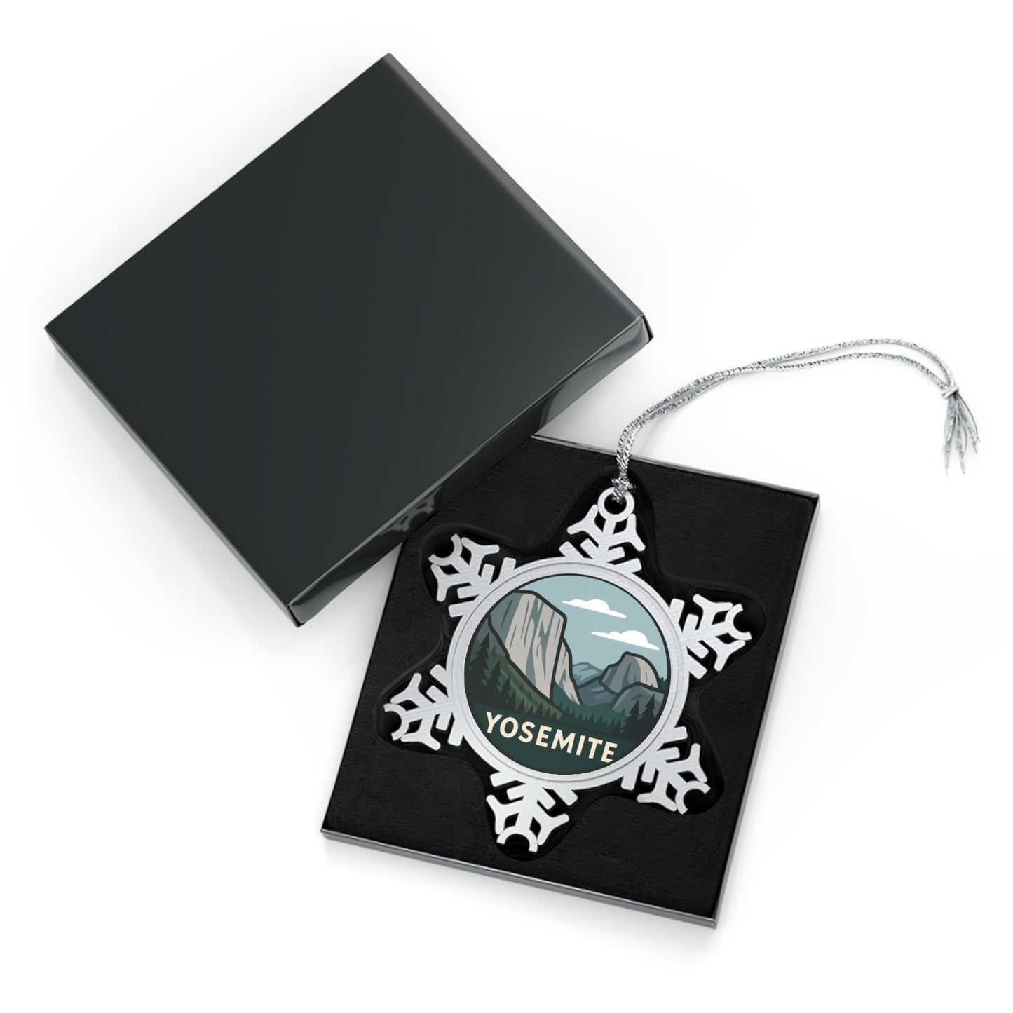 Yosemite-themed snowflake ornament in a black display box with a white background