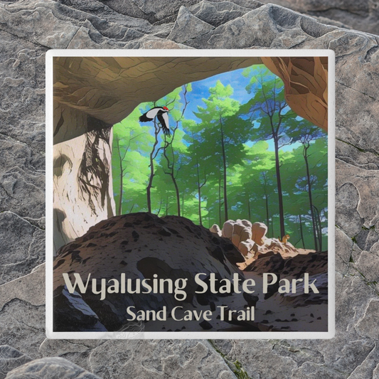 Ceramic coaster featuring a view from inside a sandstone cave looking out into a lush green forest with a woodpecker flying through the air.   Photo Background: rough textured grey rock.