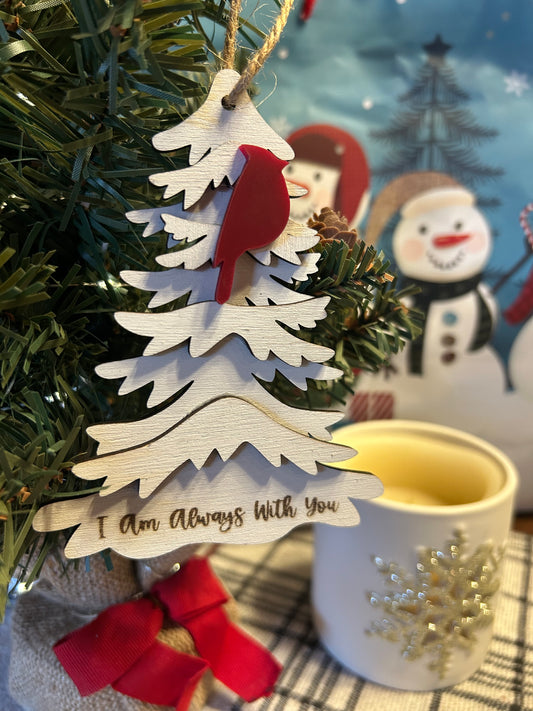 Wood tree ornament with one cardinal in a frosted cranberry color attached and the text I am always with you engraved at the bottom of the tree.