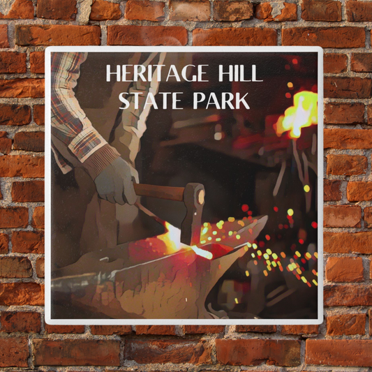 Ceramic Coaster featuring a blacksmith forging steel and the text: Heritage Hill State Park.  Photo background: brick.