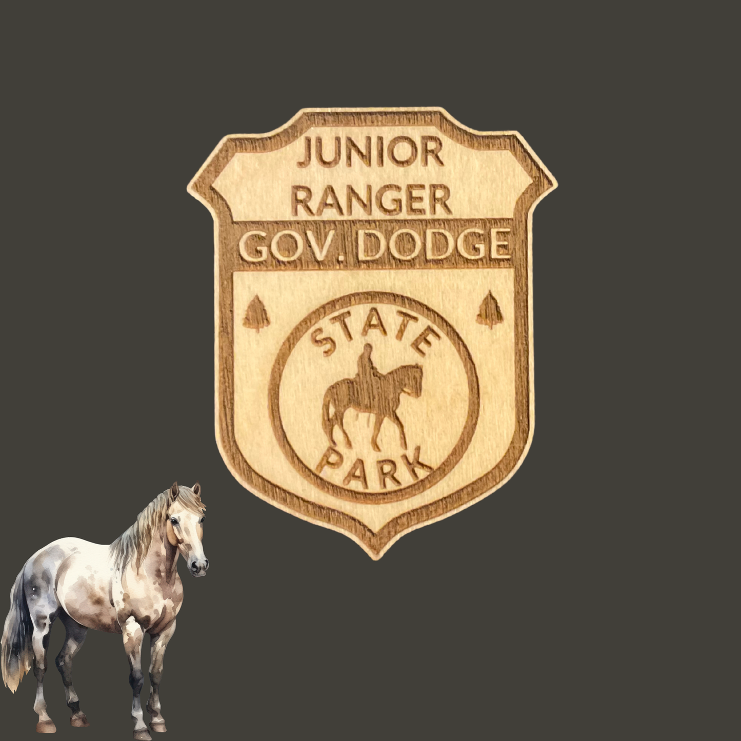 Laser engraved wood badge featuring the text: “Junior Ranger Gov Dodge State Park” with the icon of a person riding a horse.  Photo Background: dark grey background with a clip art image of a horse standing.