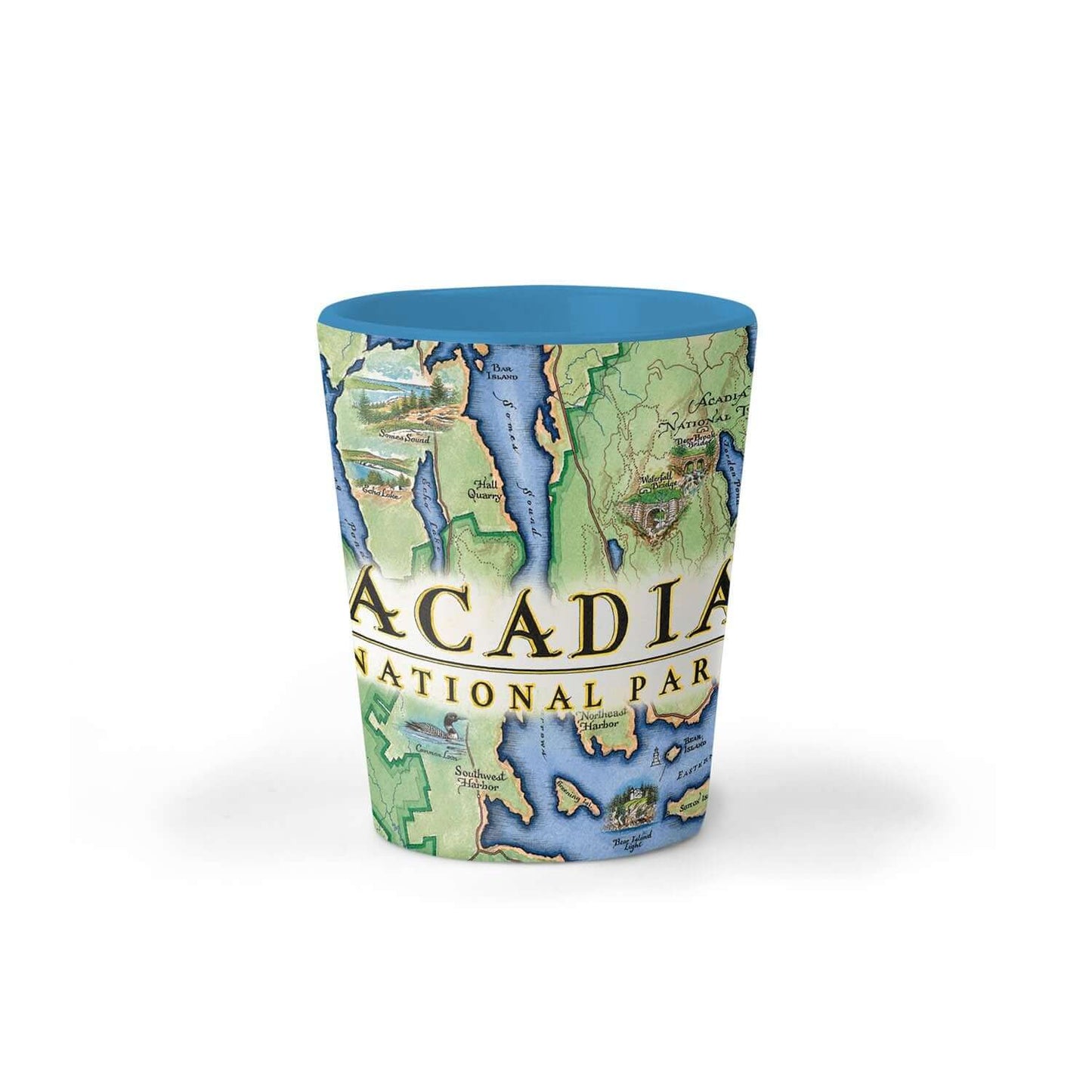 A ceramic shot glass featuring a vintage-style map print of Acadia National Park, with a solid blue interior and rim, set against a plain white background.