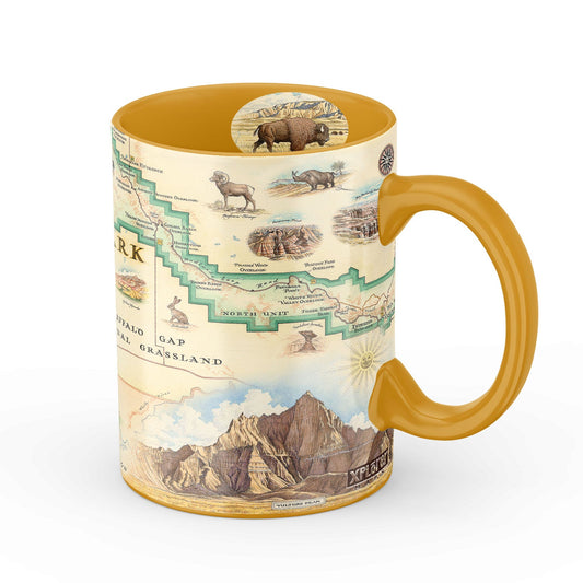 A ceramic coffee mug featuring a vintage-style map of North Dakota with illustrations of bison, a cowboy, a horse, and mountain landscapes. The mug has a mustard yellow handle and interior, set against a plain white background.