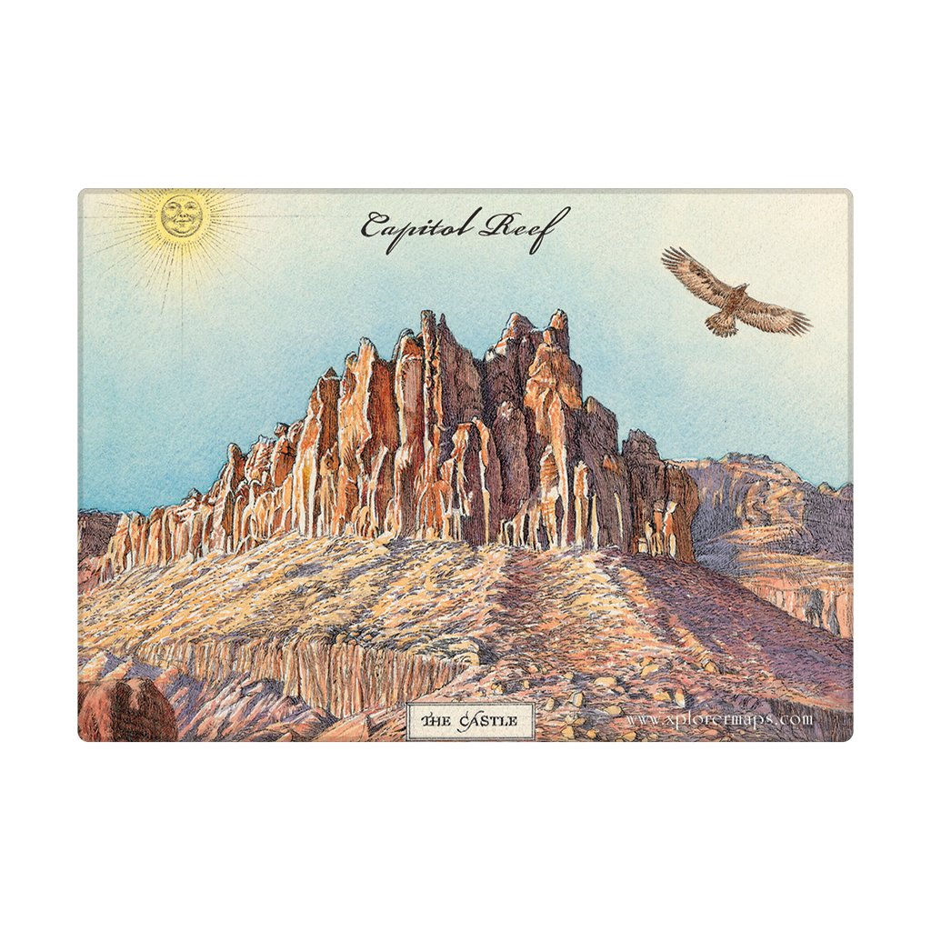 A rectangular magnet showing a desert rock formation with the words 'Capitol Reef' and 'The Castle,' plus a sun and a bird in the sky, photographed against a plain white background.