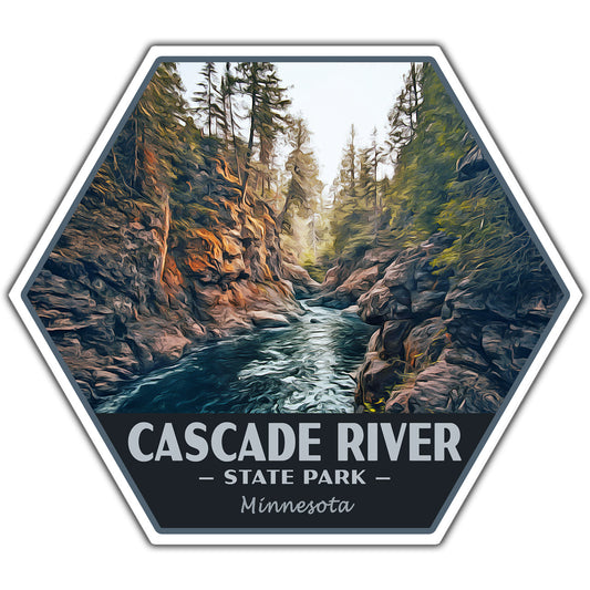 A hexagonal sticker or patch featuring an illustrated landscape of the Cascade River State Park in Minnesota, with a river flowing between rocky cliffs and pine trees. The bottom section is dark gray with white text reading 'CASCADE RIVER - STATE PARK - Minnesota'.
