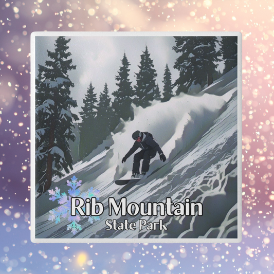 Ceramic coaster featuring a snowboarder going down a snowy, wooded slope and the text: Rib Mountain State Park.  Photo background: snowflakes falling