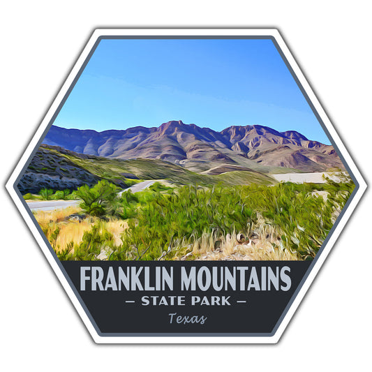 A hexagonal sticker featuring a stylized landscape of the Franklin Mountains State Park in Texas, with green brush in the foreground, rocky mountains under a blue sky, and a dark gray banner at the bottom reading 'FRANKLIN MOUNTAINS - STATE PARK - Texas'.