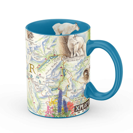 A ceramic mug featuring a detailed map print of Glacier National Park with illustrations of mountain goats, wildflowers, and a snowy sheep on a white background.