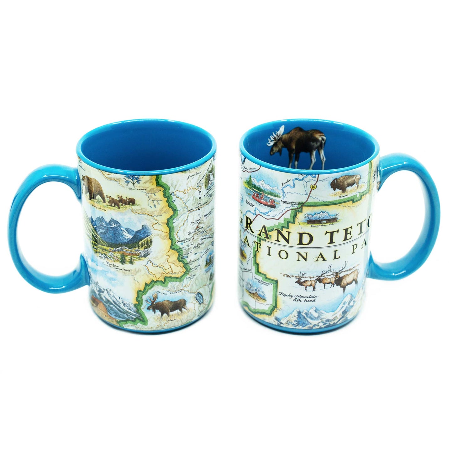 Two ceramic mugs with bright blue interiors and handles, printed with a Grand Teton National Park map and scenic illustrations, shown on a white background.