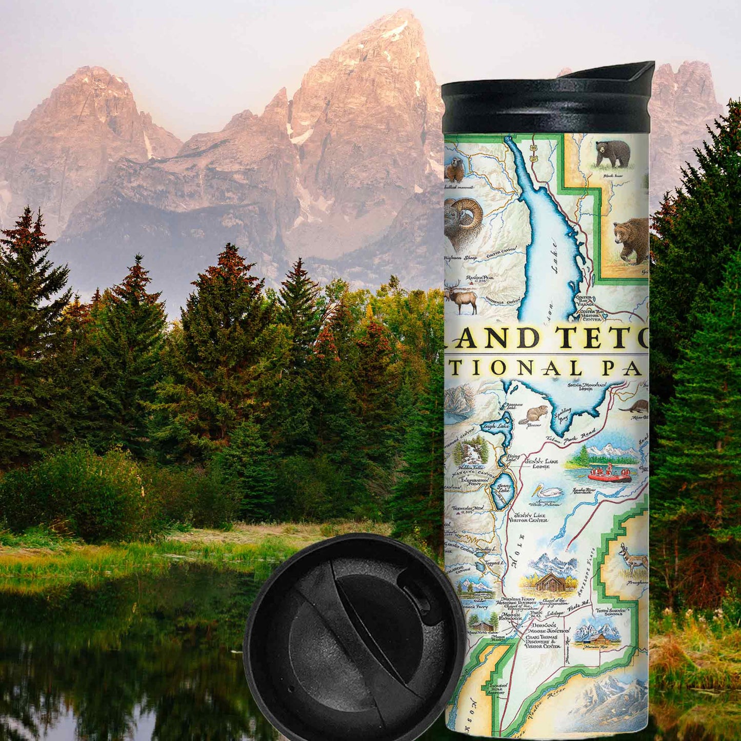 Stainless steel water bottle with a map of grand Tetons national Park printed on it displayed against a forest and mountain background