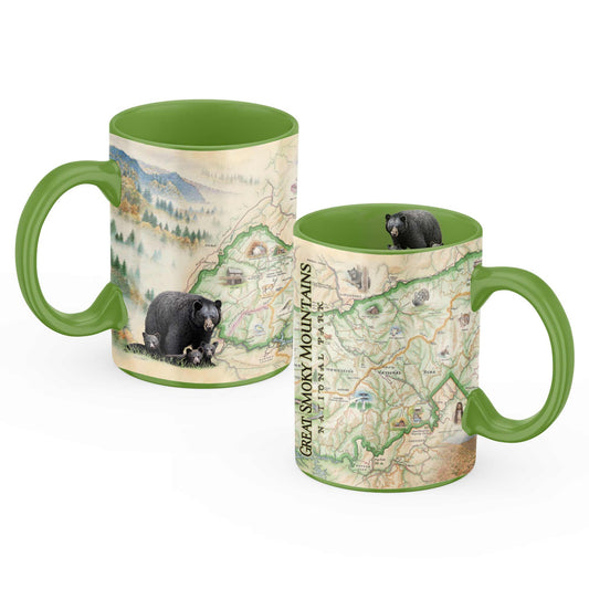 Two ceramic mugs with green handles and interiors, featuring a Great Smoky Mountains National Park map design with black bears, shown on a white background.