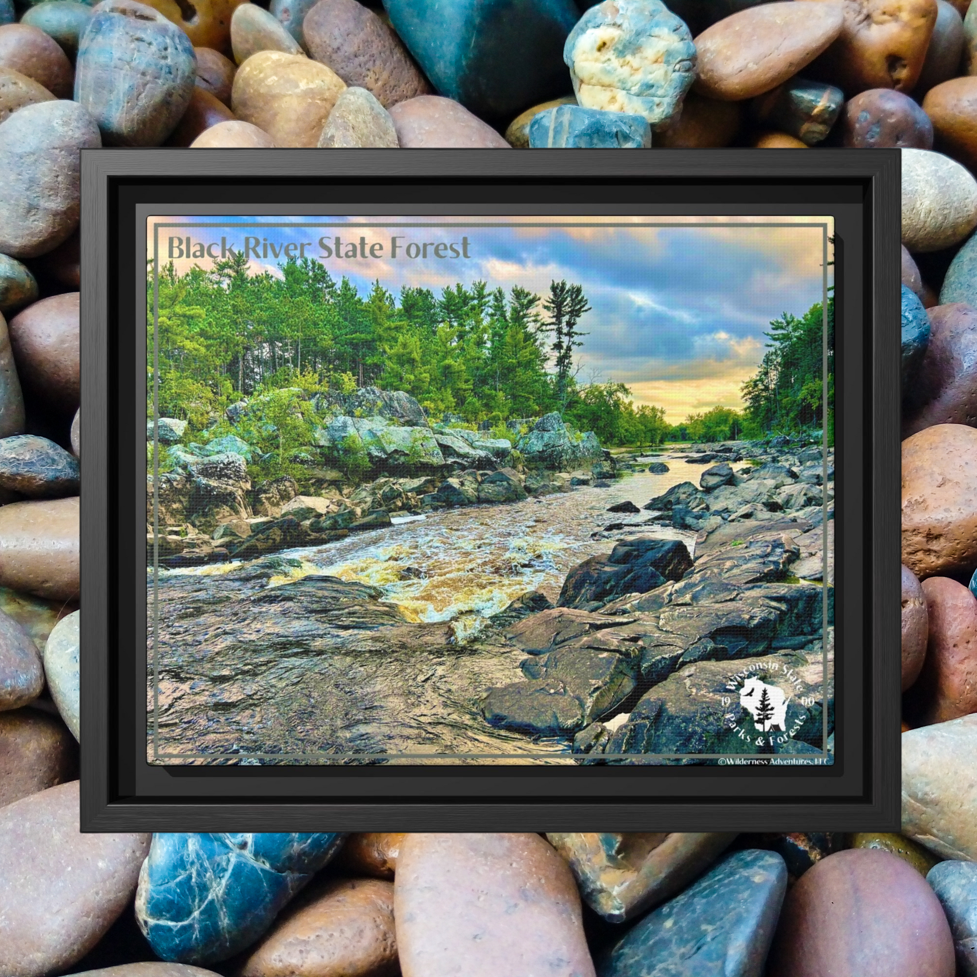 Framed canvas print of the Black River and rapids at sunset.  Photo background: colorful river rocks.