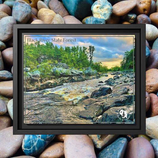 Framed canvas print of the Black River and rapids at sunset.  Photo background: colorful river rocks.