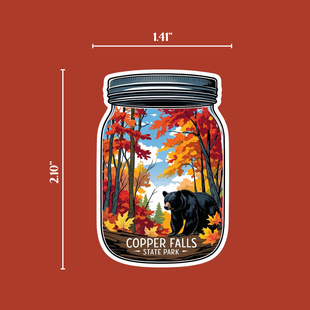 Mason jar decal with a bear walking in an autumn woods on an orange background with measurements indicating the size of the decal.