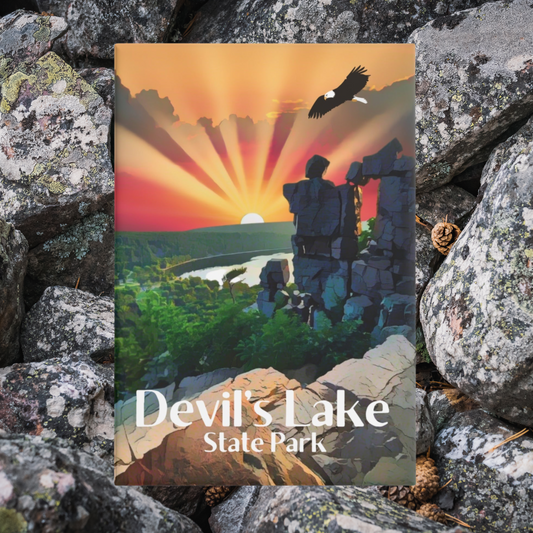 Magnet design featuring a Sunset over Devil’s Lake and devils doorway with a bald eagle flying above.  Photo background: quartzite rocks.