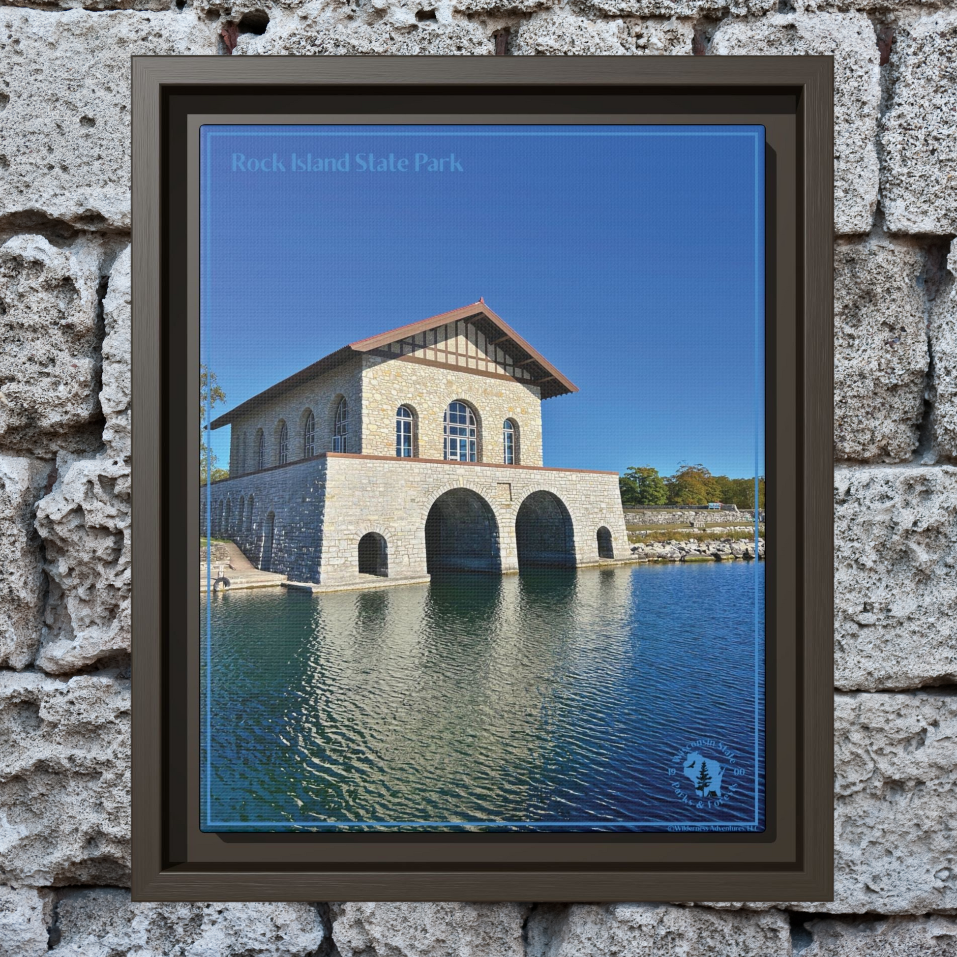 Espresso Framed canvas print featuring the iconic stone boathouse at Rock Island State park set against a clear blue sky and blue water.  Photo background, rustic stacked rocks.