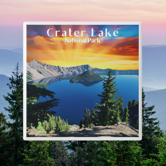 Ceramic coaster featuring a design of a vivid sunset over crater Lake and the text crater Lake national park.  photo background: colorful sky over fogged in mountains with pine trees in the foreground.