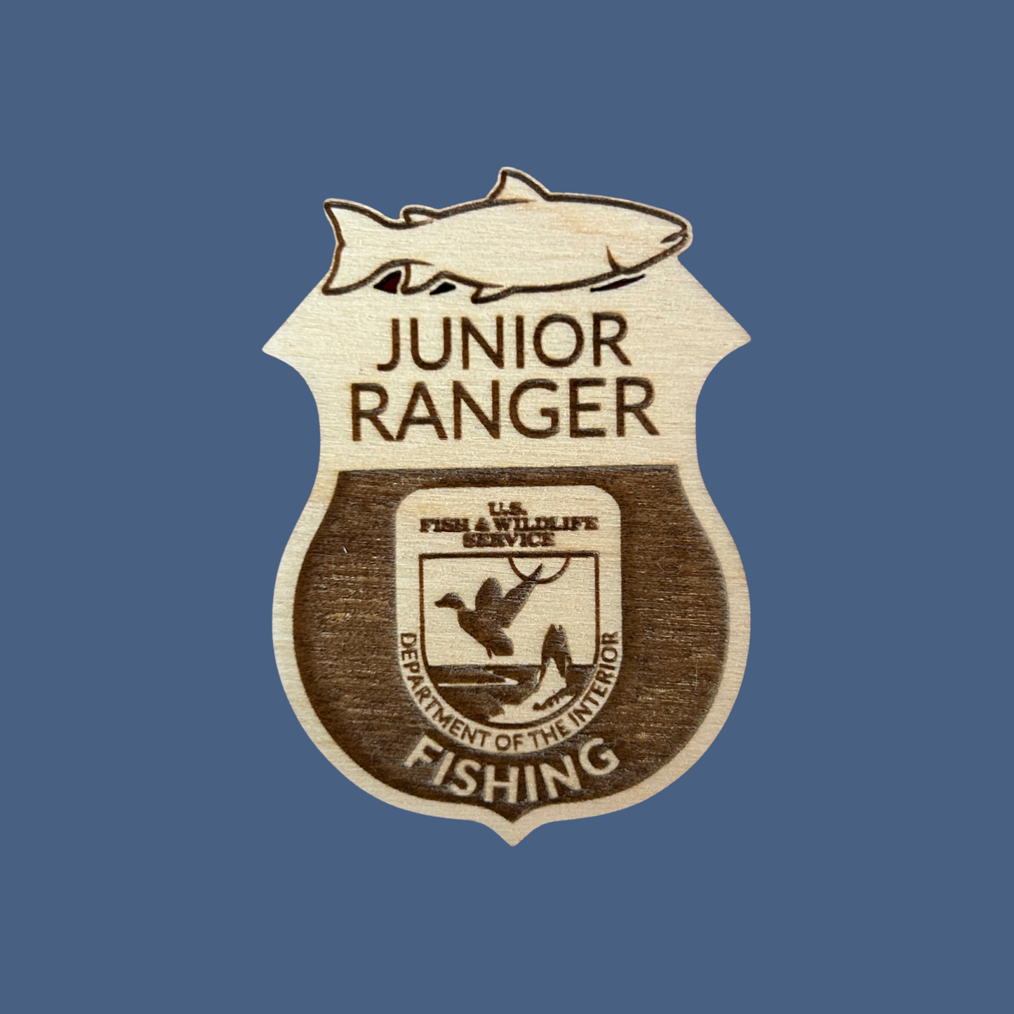 Junior Ranger badge with fishing theme on a blue background