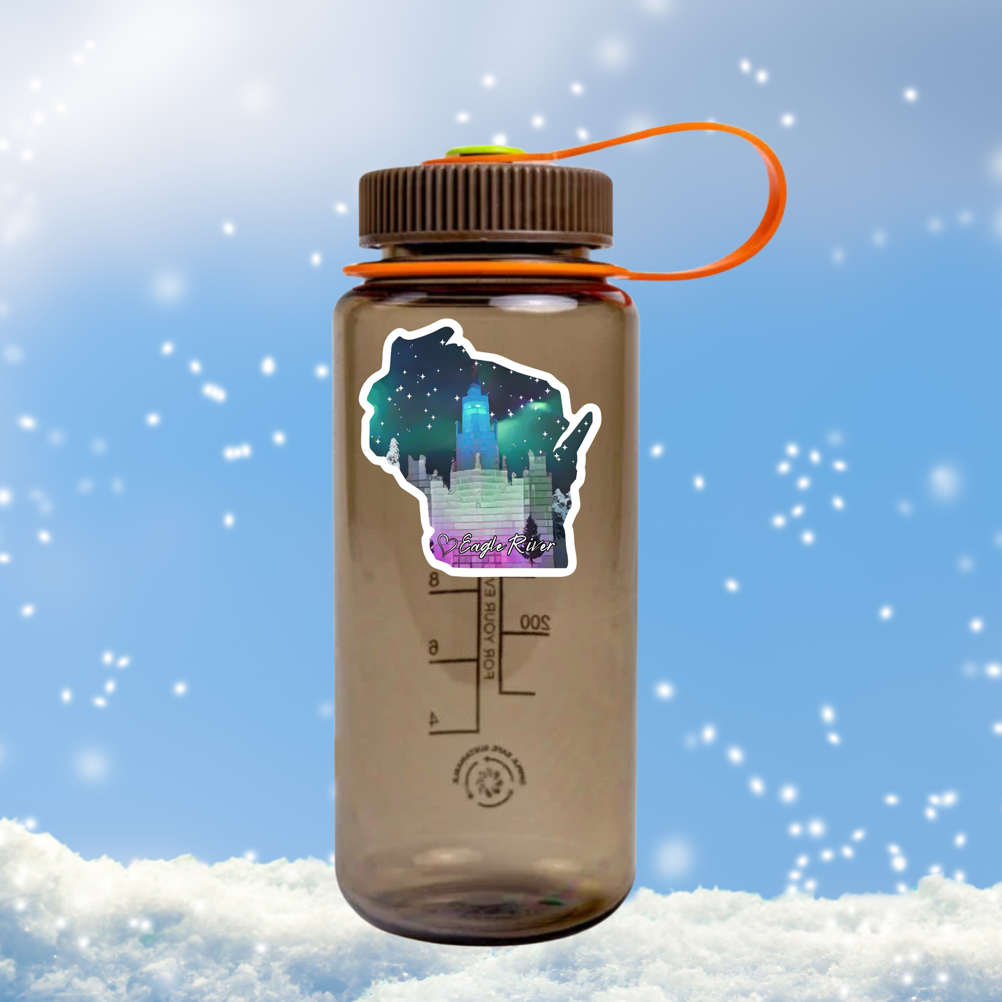 A Wisconsin shaped sticker featuring a design of the Eagle River ice castle on a brown water bottle against the snowy background.