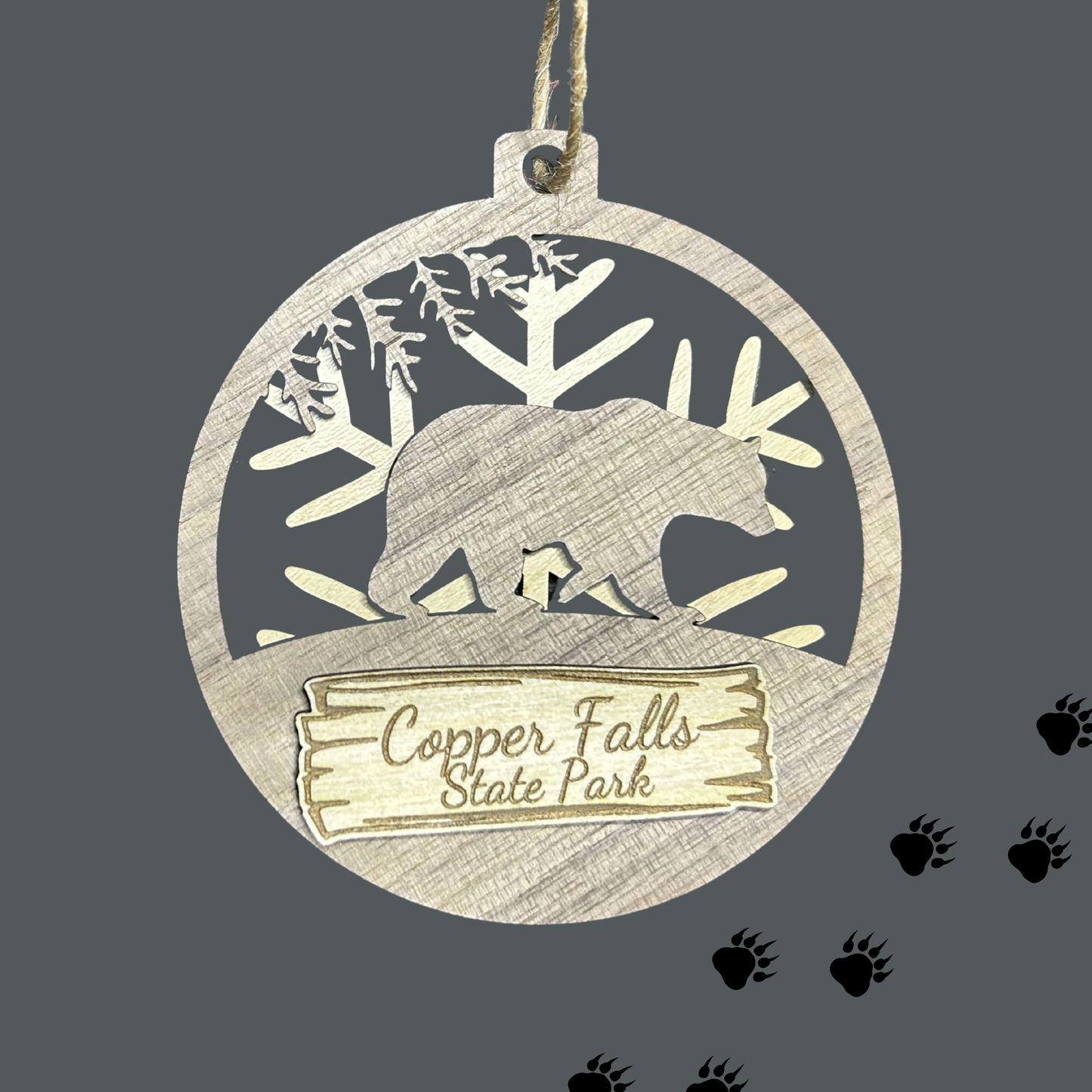 Wood Bear magnet with snowflake background and text "Copper Falls State Park" against a gray background.