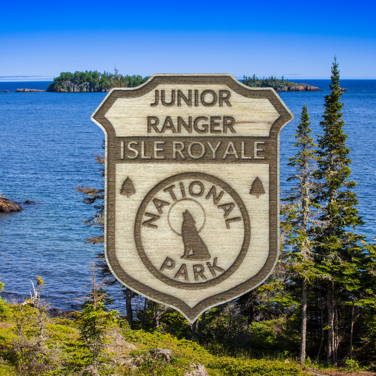 Junior Ranger Isle Royale National Park badge with a scenic background of water and trees.