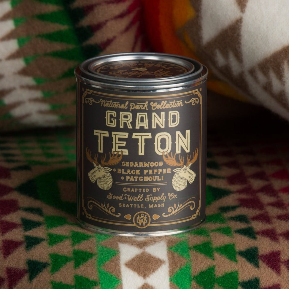 Grand Teton candle can on a patterned fabric background