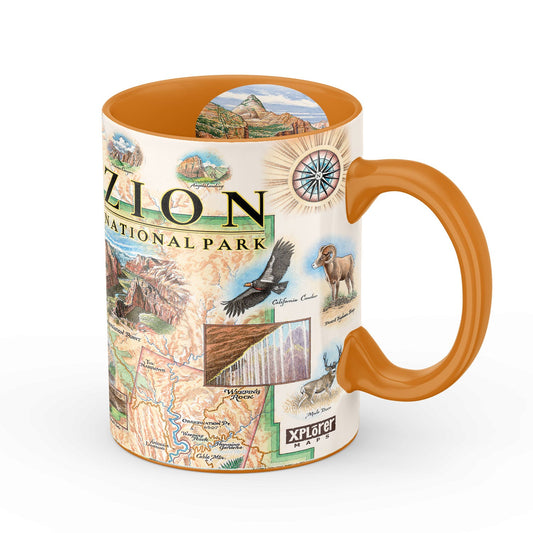 A ceramic mug featuring a detailed Zion National Park illustration on the exterior and a solid orange handle, rim, and interior, shown against a plain white background.