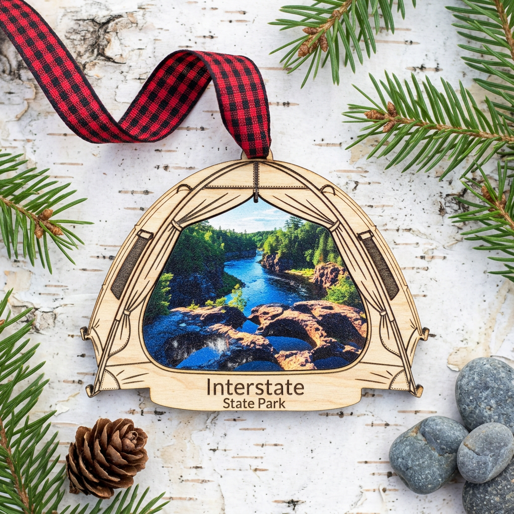 Interstate State Park tent shaped ornament Laying on birch bark with evergreen and river stones