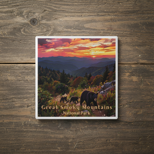 Coaster with a scenic design of bears in the Great Smoky Mountains National Park on a wooden surface.