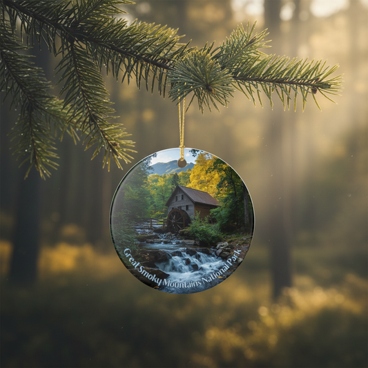 Round ornament with Great Smoky Mountains National Park scene hanging on a tree branch