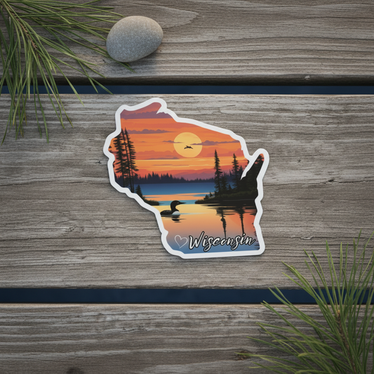 Sticker of a loon with sunset design on wooden surface