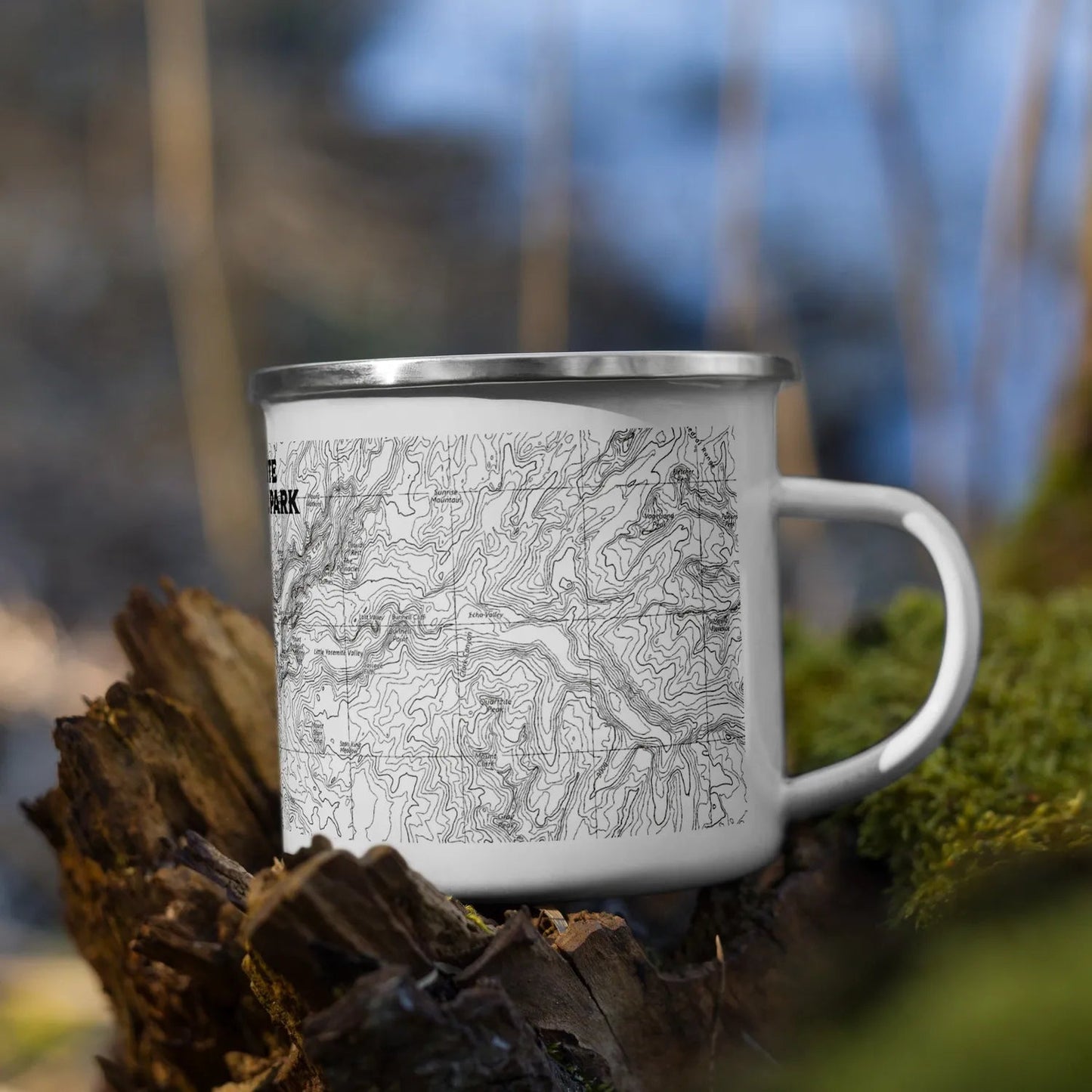 Yosemite national Park topographical enamel mug on a rotted stump in the woods
