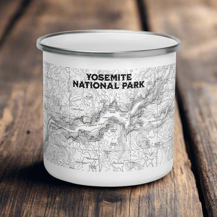 Yosemite national Park topographic enamel camping mug on a wood surface
